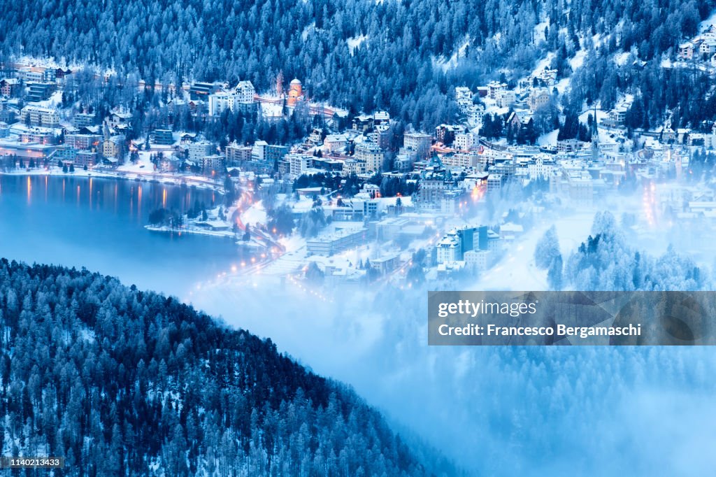 Elevated view of Sankt Moritz at dusk. Engadine valley, Canton of Grisons, Switzerland, Europe.