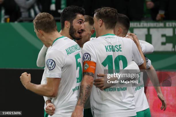 Davy Klaassen of Bremen celebrates his team's second goal with team mates during the DFB Cup quarterfinal match between FC Schalke 04 and Werder...