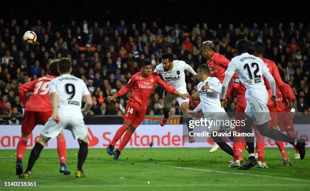 Ezequiel Garay of Valencia scores his side's second goal during the La Liga match between Valencia CF and Real Madrid CF at Estadio Mestalla on April...