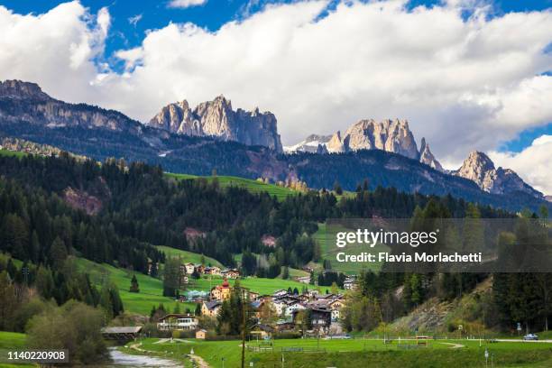 soraga town and dolomites mountains in northern italy - soraga stock pictures, royalty-free photos & images