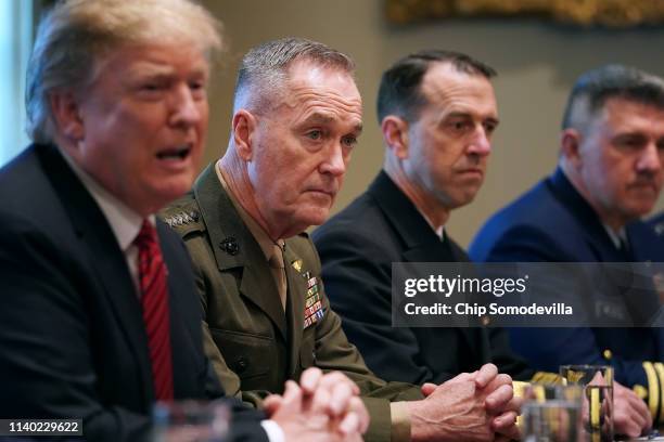 President Donald Trump talks to reporters during a briefing with military leaders, including Chairman of the Joint Chiefs Gen. Joseph Dunford, Chief...