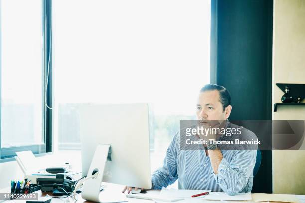 Businessman working on project on computer in office