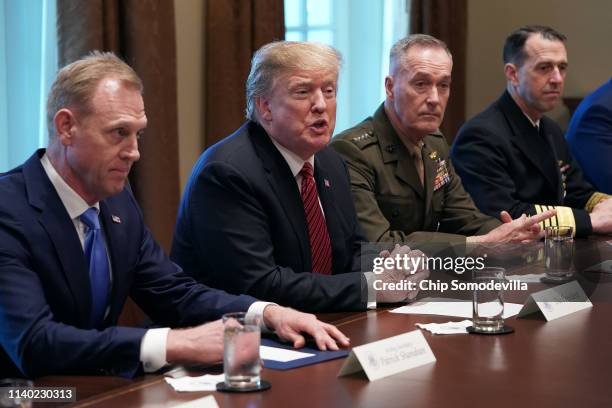 President Donald Trump talks to reporters during a briefing with military leaders, including acting Defense Secretary Patrick Shanahan, Chairman of...