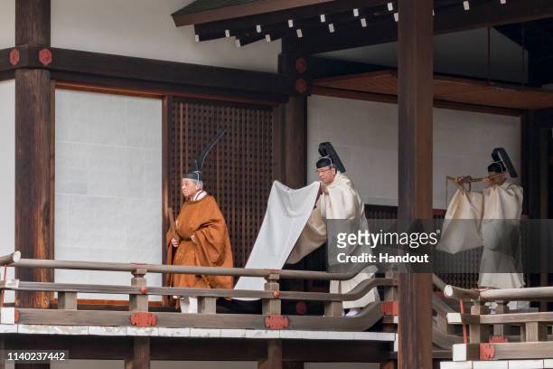 In this handout image provided by Imperial Household Agency, Emperor Akihito is seen attending the abdication ceremony at the Imperial Palace on...