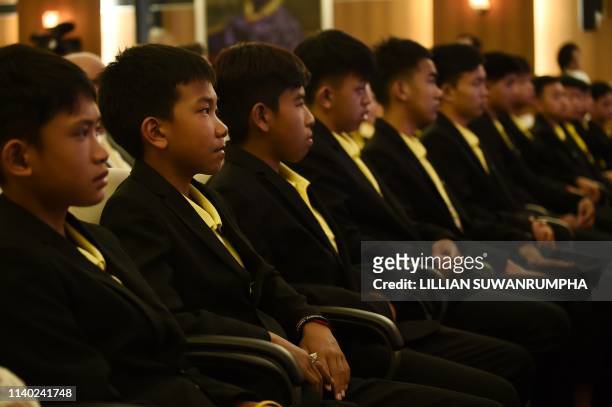 Members of the 'Wild Boars' football team attend a press conference in Bangkok on April 30, 2019 regarding a Netflix series about the rescue of the...