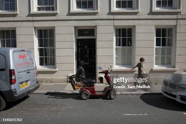 Mobility scooter parked in a parking layby on the 20th April 2019 in Hastings in the United Kingdom.