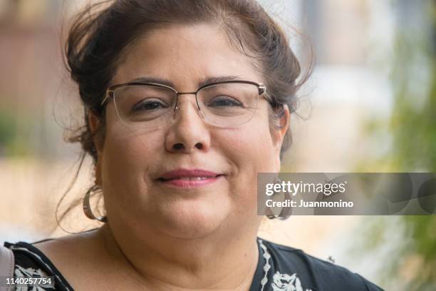 smiling hispanic woman (real people) - fat lesbian stock pictures, royalty-free photos & images