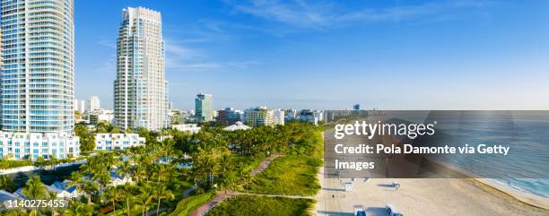 high drone view of south beach in miami from south pointe park, florida, usa - miami beach south pointe park stock pictures, royalty-free photos & images