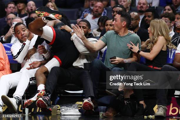 Chris Paul of the Houston Rockets crashes into the audience during the second half against the Los Angeles Clippers at Staples Center on April 03,...