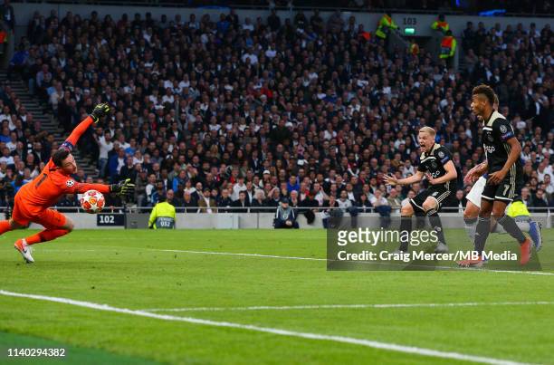 Donny van de Beek of Ajax scores the opening goal past Hugo Lloris of Tottenham Hotspur during the UEFA Champions League Semi Final first leg match...