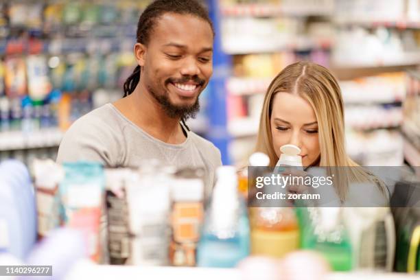 couple smelling hair conditioner - conditioner stock pictures, royalty-free photos & images