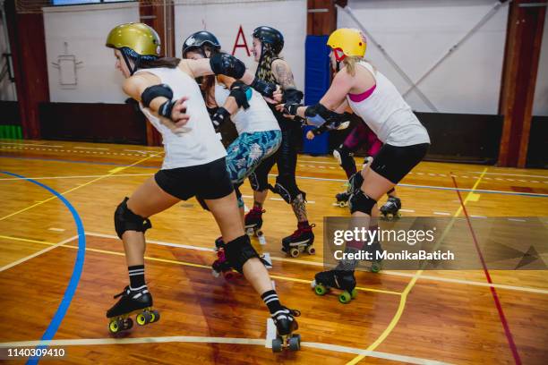 roller derby girls - roller rink stock pictures, royalty-free photos & images