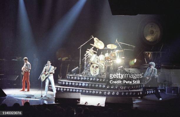 John Deacon, Freddie Mercury, Roger Taylor and Brian May of Queen perform on stage at Wembley Arena, on December 10th, 1980 in London, England.
