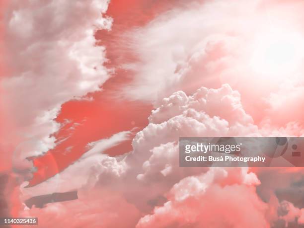 aerial view of clouds in the sky (image manipulated with pantone living coral color of the year 2019) - every cloud has a silver lining stock pictures, royalty-free photos & images