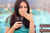 Woman Reacting after Having a Fizzy Soda Drink