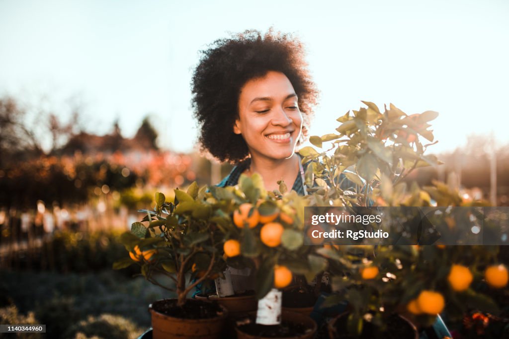 Girl planting orange tree