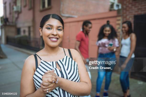 beautiful plus size dominican woman in usa with diverse friends outdoors - dominican ethnicity stock pictures, royalty-free photos & images