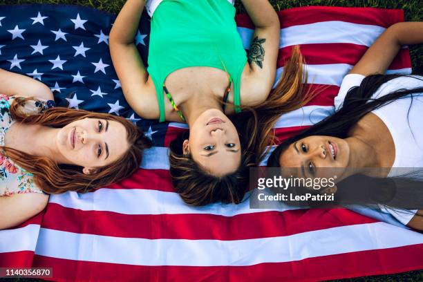 mixed group of teenagers enjoying summer in italy - hot filipina women stock pictures, royalty-free photos & images