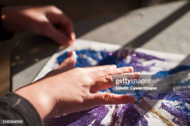 close up of girls hands creating glitter art - sparkle children stock pictures, royalty-free photos & images