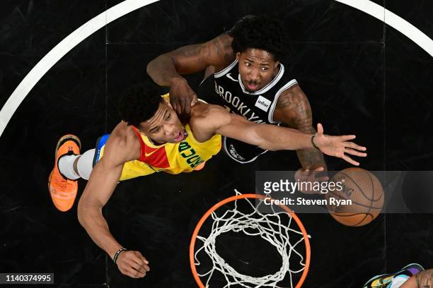 Giannis Antetokounmpo of the Milwaukee Bucks and Ed Davis of the Brooklyn Nets battle for the rebound at Barclays Center on April 01, 2019 in New...