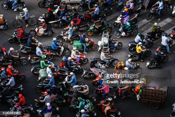 the streets are very crowded in rush hours with many motobikes in the city - vietnam stockfoto's en -beelden