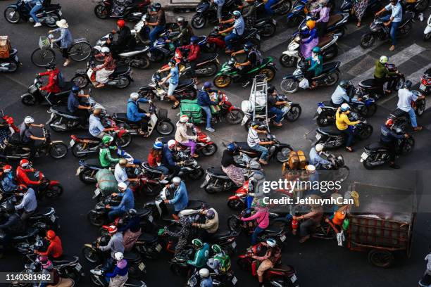 the streets are very crowded in rush hours with many motobikes in the city - ho chi minh city 個照片及圖片檔