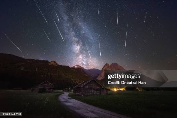 shooting stars over the alps - perseiden stock-fotos und bilder