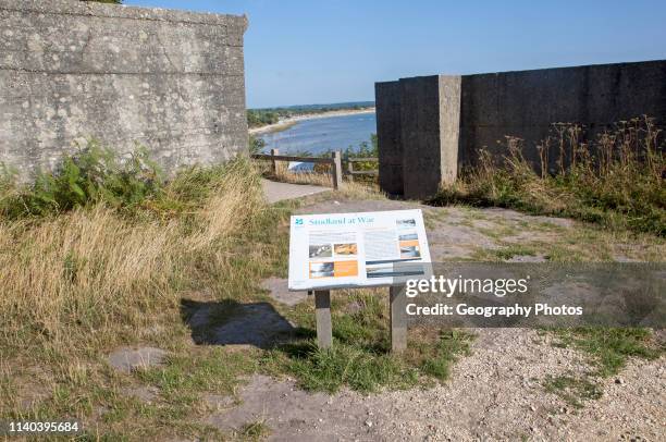 Second world war information panel by defensive structures at Fort Henry, Studland Bay, Swanage, Dorset, England, UK.