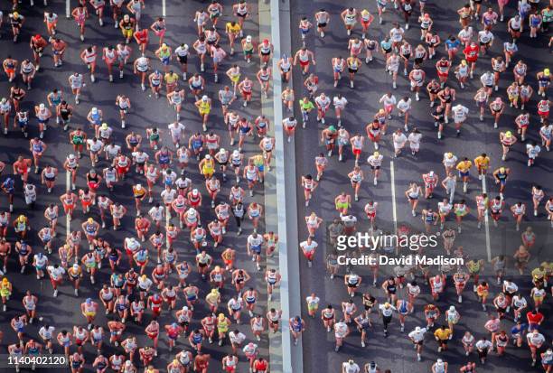 Runners competing in the 1990 New York City Marathon cross the Verrazzano Bridge from Staten Island to Brooklyn near the beginning of the race on...