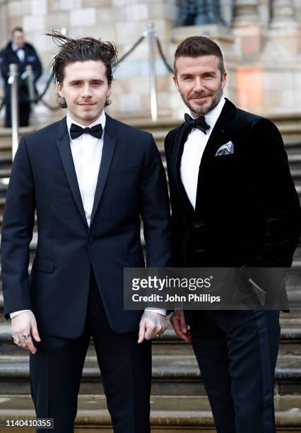 Brooklyn Beckham and David Beckham attend the "Our Planet" global premiere at Natural History Museum on April 04, 2019 in London, England.