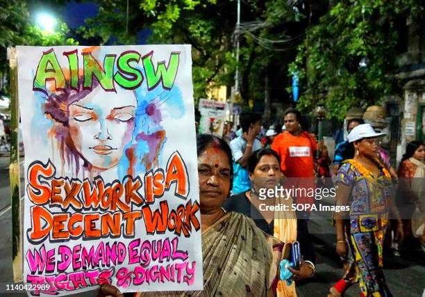 Sex workers seen walking with a placard during the rally. Sex Workers of Sonagachi Kolkata, the Largest Red light area of south East Asia took part...