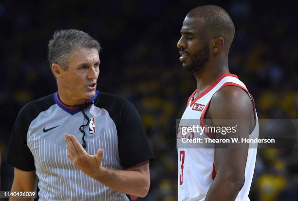 Referee Scott Foster talks over a foul call made on Chris Paul of the Houston Rockets against the Golden State Warriors in Game Two of the Second...