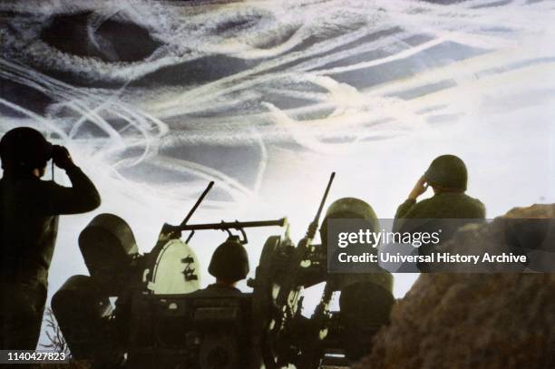 Crew of Multiple Gun Motor Carriage M16 Waiting to Fire on Enemy Plane as Vapor Trails Fill Sky, Ardennes-Alsace Campaign, Battle of the Bulge, 1944.