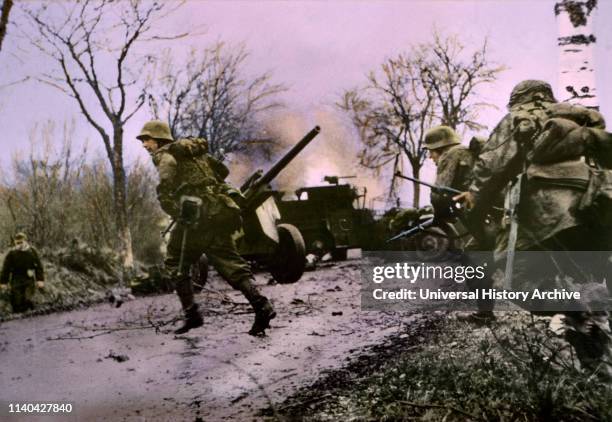 Enemy Troops Passing Burning U.S. Equipment, Ardennes-Alsace Campaign, Battle of the Bulge, 1945.