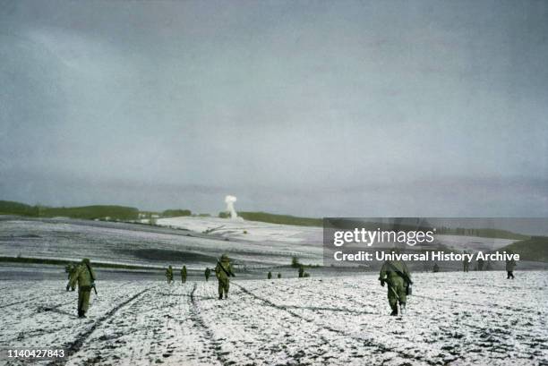 Infantrymen Advance, Bastogne, Belgium, Ardennes-Alsace Campaign, Battle of the Bulge, December 1944.