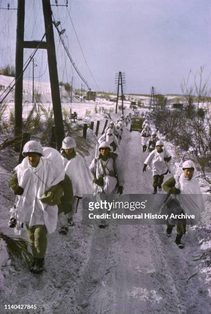 First Army Troops, Wearing Snow Camouflage Capes, Advance, Ardennes-Alsace Campaign, Battle of the Bulge, 1945.