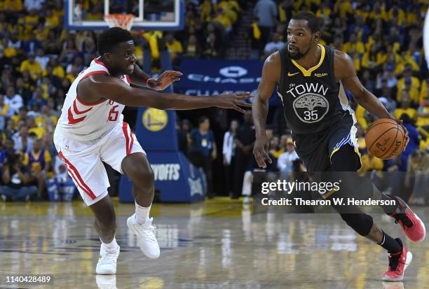 Kevin Durant of the Golden State Warriors drives on Clint Capela of the Houston Rockets in Game Two of the Second Round of the 2019 NBA Western...