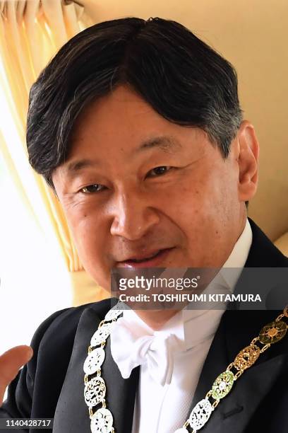 Japans new Emperor Naruhito arrives at the Imperial Palace in Tokyo on May 1, 2019. - Japan's new Emperor Naruhito formally ascended the...