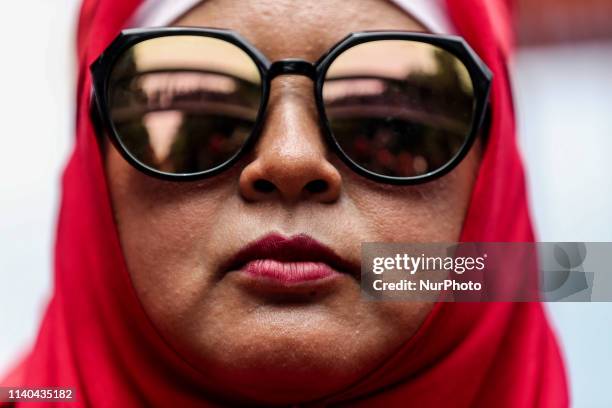 Indonesian workers stand during International Labor Day at a main street of a business district in Jakarta, May 1, 2019.