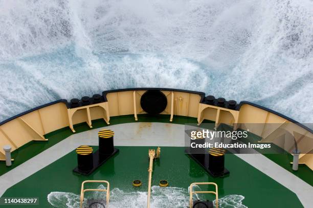 Bow of the icebreaker, Kapitan Khlebnikov, crashing into wave in rough seas crossing the Drake Passage, Southern Ocean.