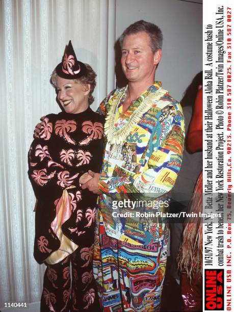 New York, NY. Bette Midler and her husband at their Halloween Aloha Ball. A costume bash to combat trash to benefit her New York Restoration Project.