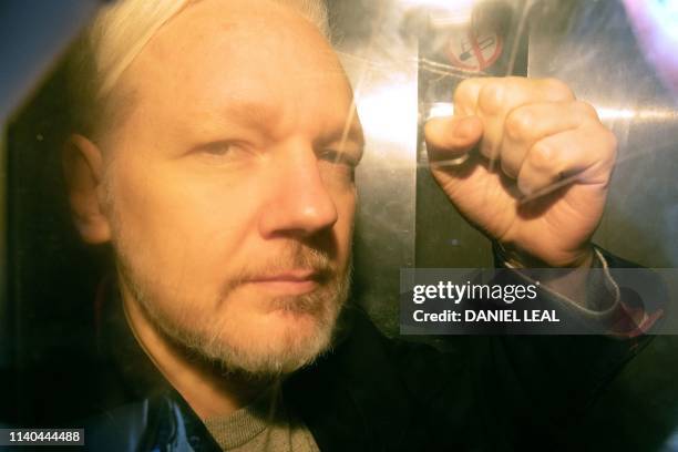 WikiLeaks founder Julian Assange arrives at court in London on May 1, 2019 to be sentenced for bail violation. - Assange will be sentenced today for...