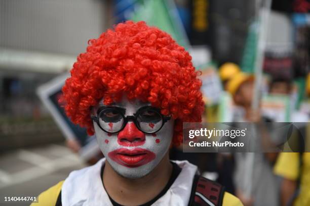 Protester is seen dressed as Mcdonalds mascot Ronald Mcdonald during the May Day rally also know as Labor day in Hong Kong, China. 1 May 2019.