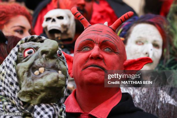 People dressed as witches and devils take part in an event to celebrate Walpurgis Night in Wernigerode, central Germany, at the foot of the Brocken...