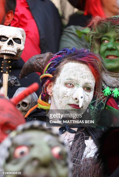People dressed as witches and devils take part in an event to celebrate Walpurgis Night in Wernigerode, central Germany, at the foot of the Brocken...