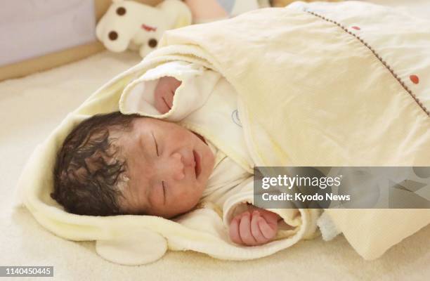 Newborn baby girl Oto Seki sleeps at a hospital in Kumamoto, southwestern Japan, on May 1 the first day of Japan's new imperial era Reiwa. ==Kyodo