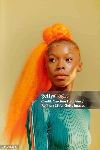Portrait Of Young Confident Women With Orange Hair
