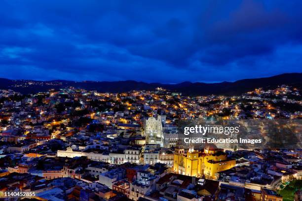 The CHURCH OF THE BASILICA and the UNIVERSITY OF GUANAJUATO at dusk, Guanajuato, Mexico.
