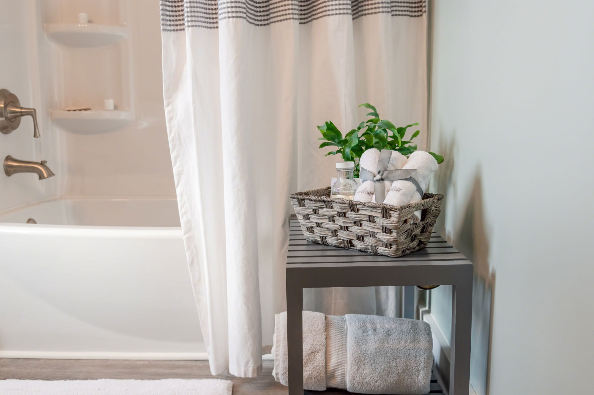 Clean modern bathroom decorated in gray and whir Clean modern bathroom decorated in gray and whir