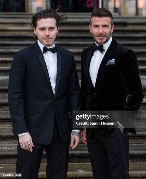 Brooklyn Beckham and David Beckham attend the "Our Planet" global premiere at Natural History Museum on April 04, 2019 in London, England.